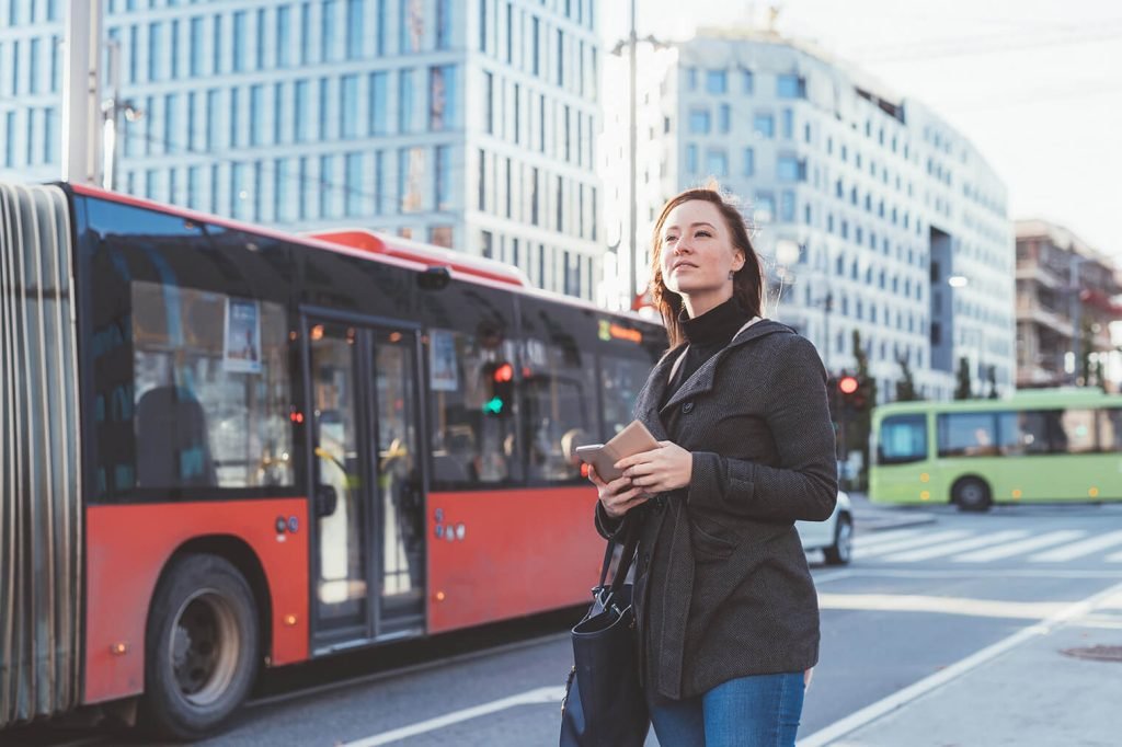young-woman-outdoor-waiting-bus-stop-2022-01-28-20-52-23-utc-1024x682
